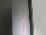 the back of a cell phone with a small screen on it