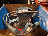 a box with a drill in it that is in a box