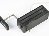 a black heat plate with a wire attached to it