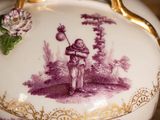 a purple and white vase with a picture of a woman holding a flower