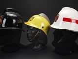 three different types of hard hats sitting on top of each other