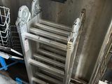 a metal rack that has a bunch of items in it