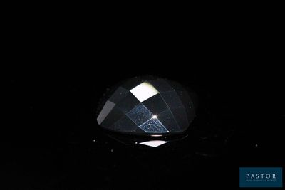 an image of a black diamond in the dark