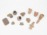 a group of ancient artifacts on a white surface
