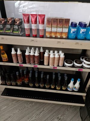a display of cosmetics products on a shelf in a store
