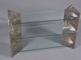 a glass shelf with three glass shelves on it