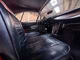 a view of the inside of a car from the driver ' s seat