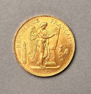 une image représentant une pièce d'or sur laquelle figure un ange tenant un drapeau