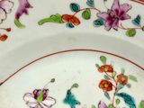 a plate with a floral design on it on a table