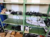 many electronics on the shelves in the room
