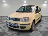 a yellow car that is parked in a room