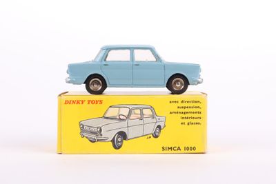 a blue toy car sitting on top of a yellow box