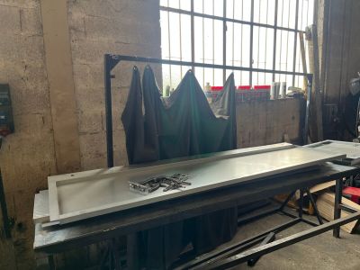 an image of a metal workbench in a factory