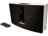 an image of a black and white speaker with a remote