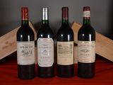 three bottles of red wine are lined up on a table