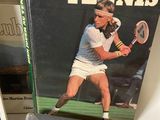 books on a shelf with a tennis player on the cover