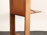 an image of a small wooden desk with a laptop on top of it