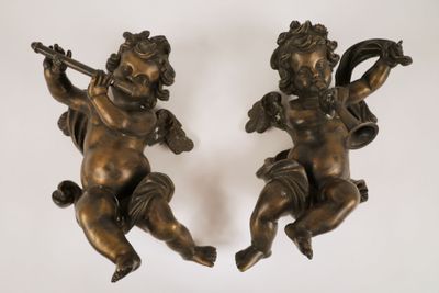 pair of antique bronze cherenshes with harps on a white background