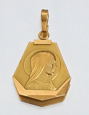 an image of a gold medal with a woman ' s face on it