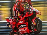 painting of a person on a motorcycle doing a wheelie on a track