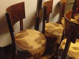 four chairs that are sitting next to each other in a room