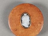 a picture of a piece of wood with a stone in it