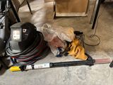 a picture of a vacuum and other tools on the floor