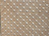 close up of a metal plate with a pattern on it