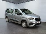 the silver van is parked in the garage of a building