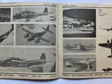 a book with pictures of airplanes in it on a table