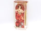 a glass box with a picture of a woman holding a poinsetti