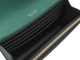 a close up of a green purse with a gold zipper