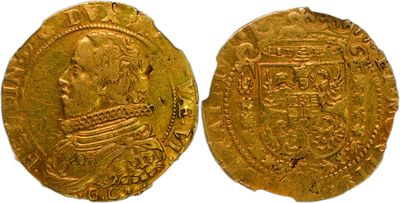 a close up of two gold coins on a white surface