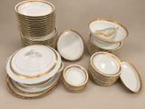 a lot of plates and bowls that are stacked together