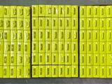 several stacks of yellow lego blocks stacked on top of each other