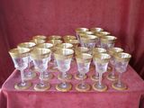 a lot of wine glasses sitting on a table