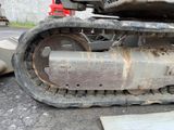 a close up of a tractor that is parked on the street