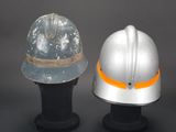 two helmets that are sitting next to each other