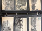 several black and white photos of a train on display in a binder