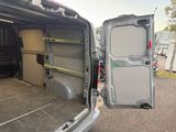 the back of a van with the door open and the back of the van with the door open