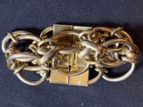 a close up of a metal chain with a lock on it