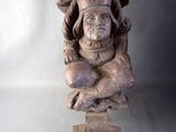 a statue of a woman holding a child on her lap