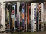 a lot of dvds stacked on top of each other