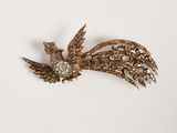 une image représentant une broche surmontée d'un oiseau