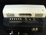 a black and white machine on a black table