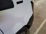 a white truck that is parked in a parking lot