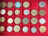 a red box filled with different types of coins