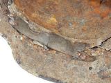 a rusted hat that has a metal band around it