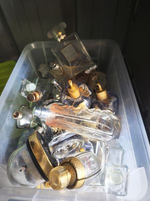 a plastic container filled with bottles and bottles on a table