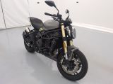 a picture of a motorcycle parked in a garage